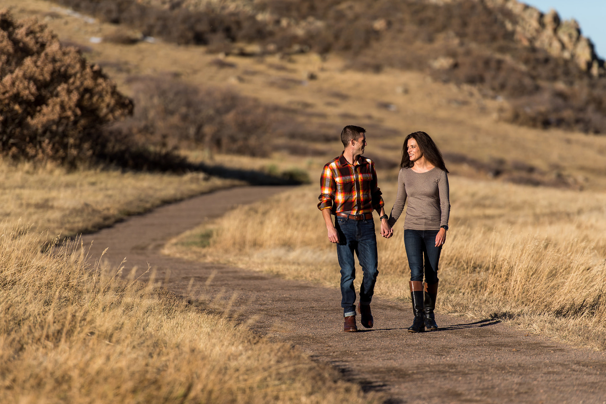 Victoria and Justin walk in Roxborough State Park Littleton for their engagement session.