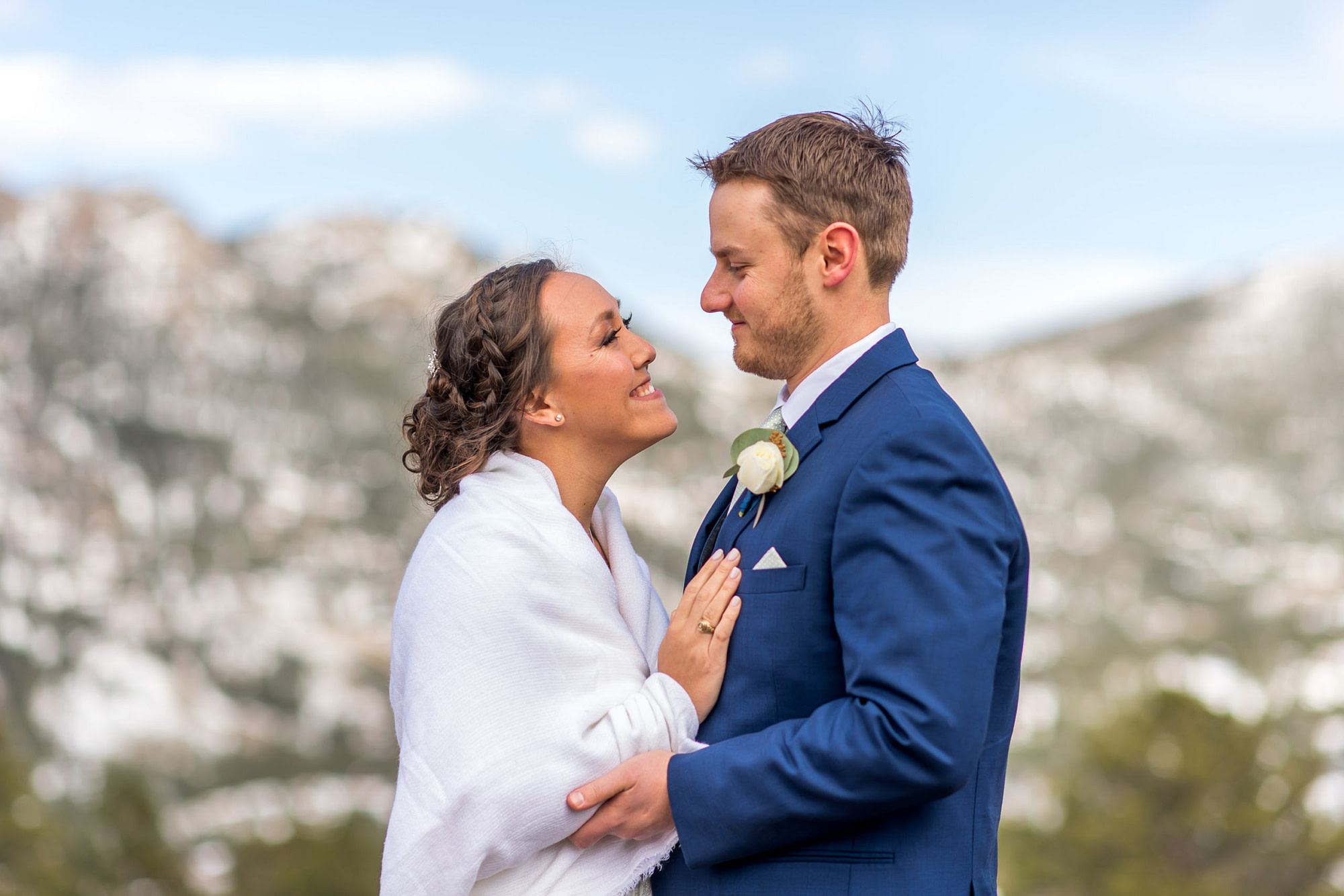 The bride and groom look into each other's eyes during their YMCA of the Rockies wedding in Estes Park, Colorado.