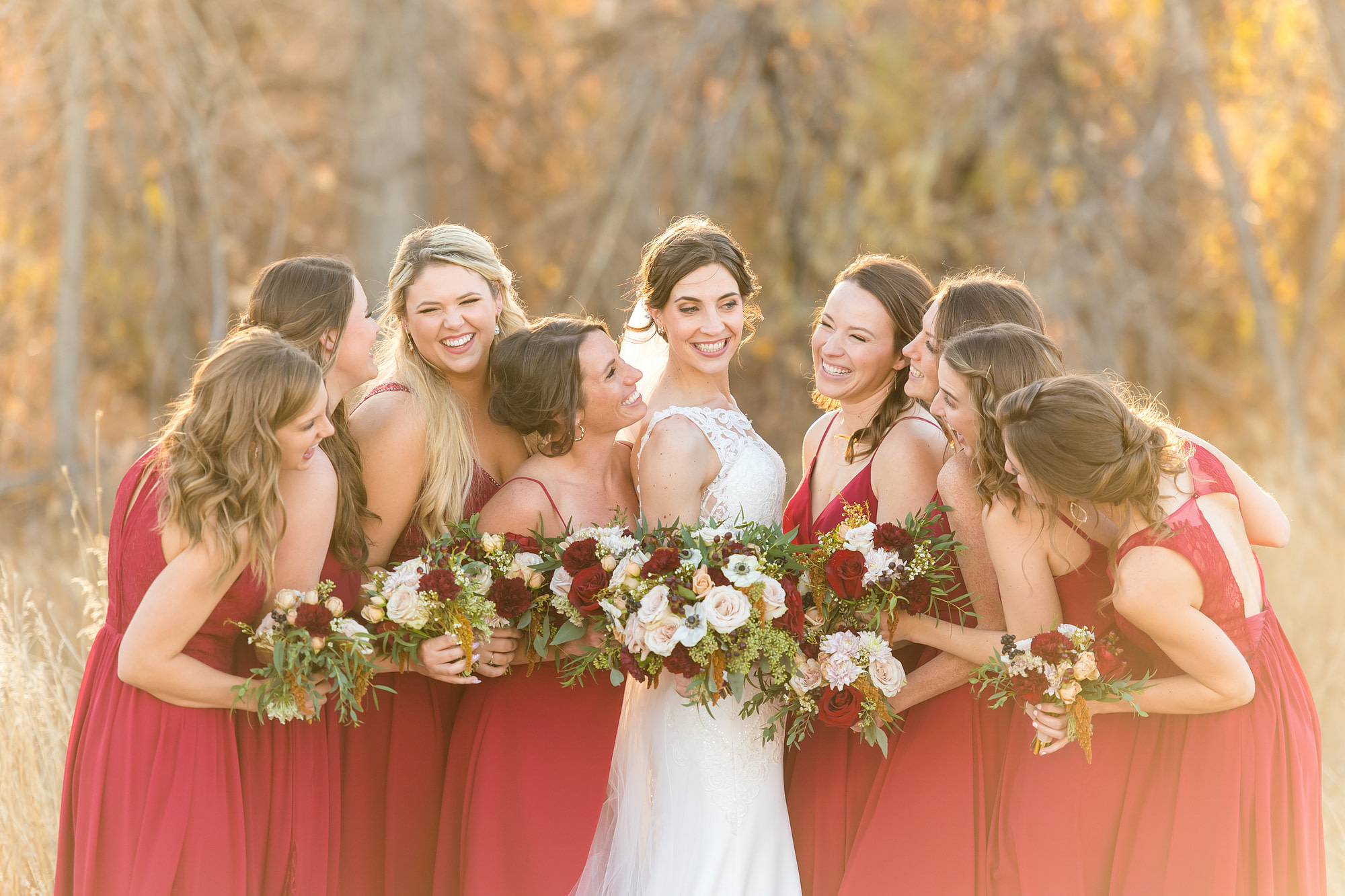 Bride poses with her bridesmaids at Cherry Creek State Park in Aurora, Colorado.