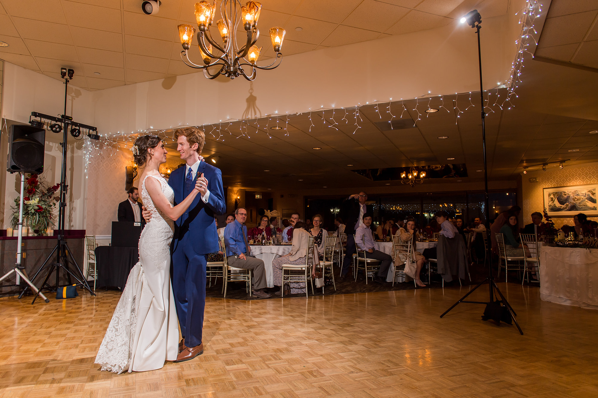 The bride and groom dance at the Franciscan Event Center during their wedding in Centennial, Colorado.