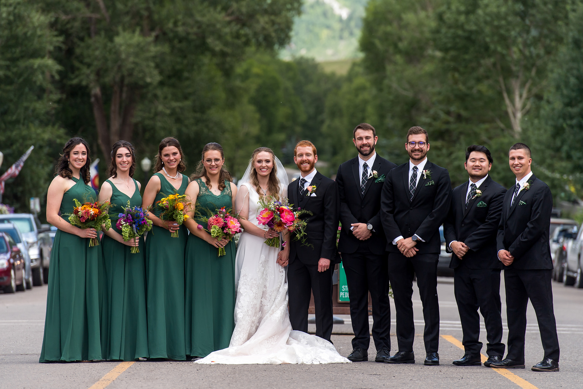 The bride, groom and bridal party pose downtown during a Telluride, Colorado, wedding.