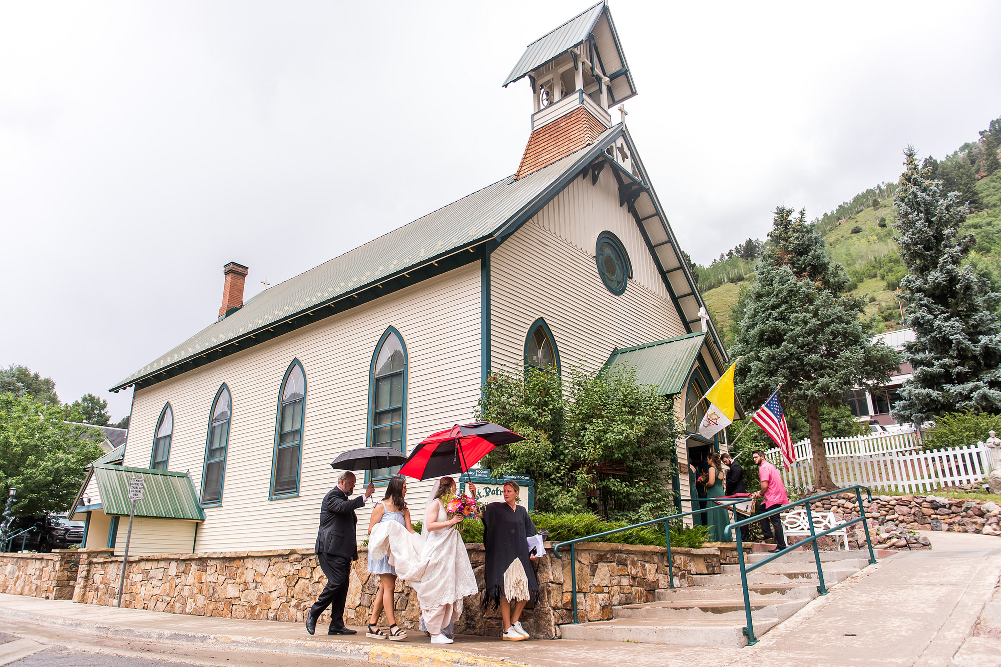 The bride walks into St. Patrick's Catholic Church in Telluride, Colorado.