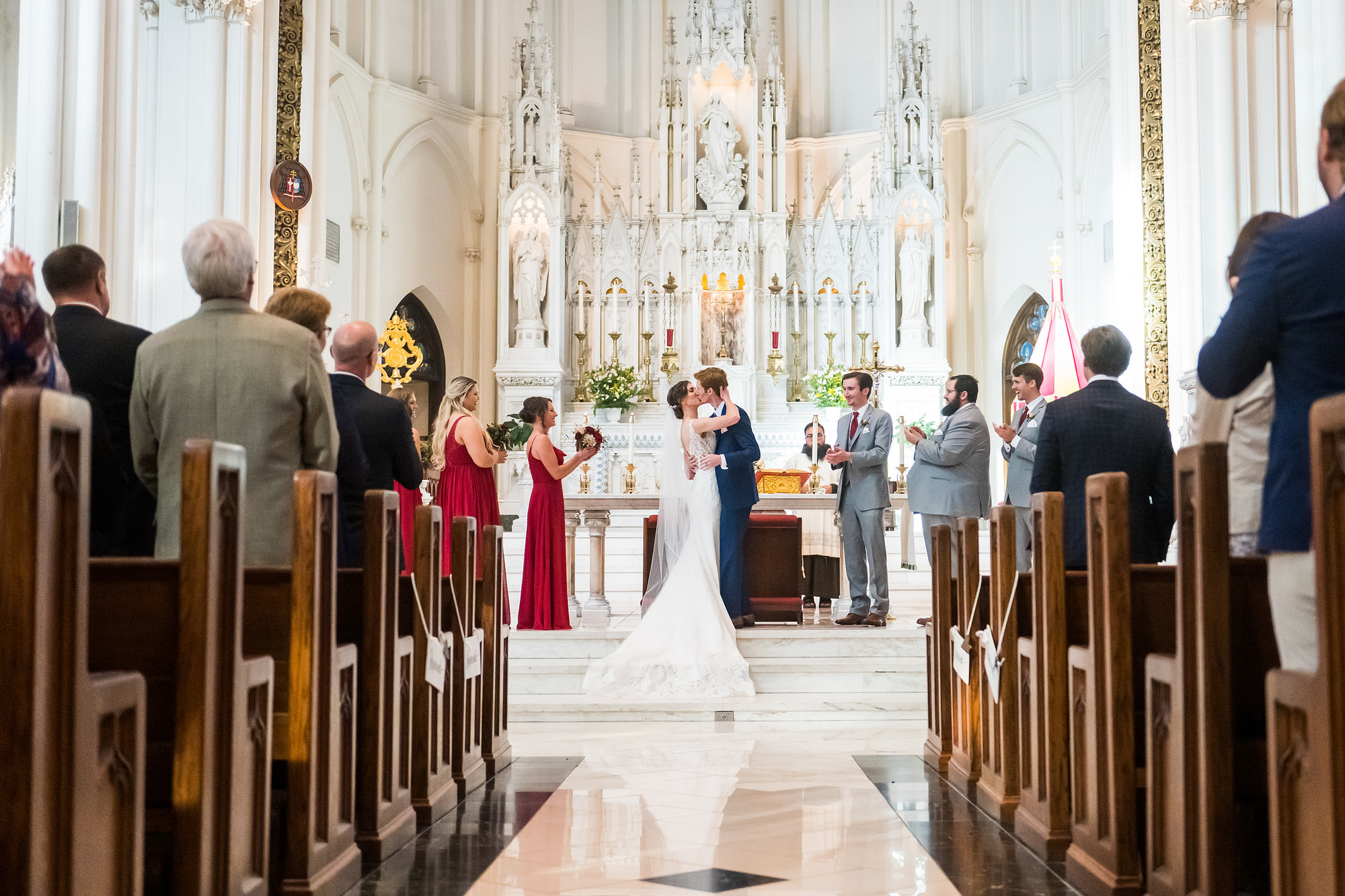 Bride and groom kiss during a Cathedral Basilica of the Immaculate Conception wedding in Denver, Colorado.