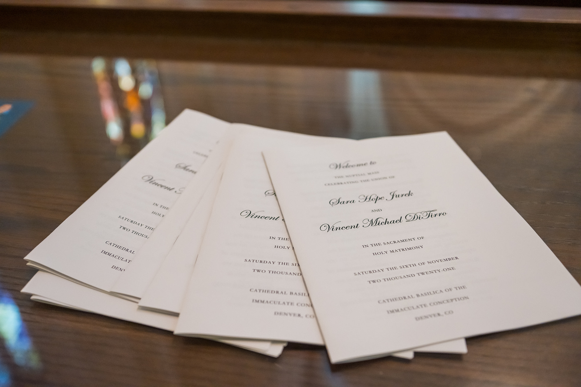 Programs during a Cathedral Basilica of the Immaculate Conception wedding in Denver, Colorado.