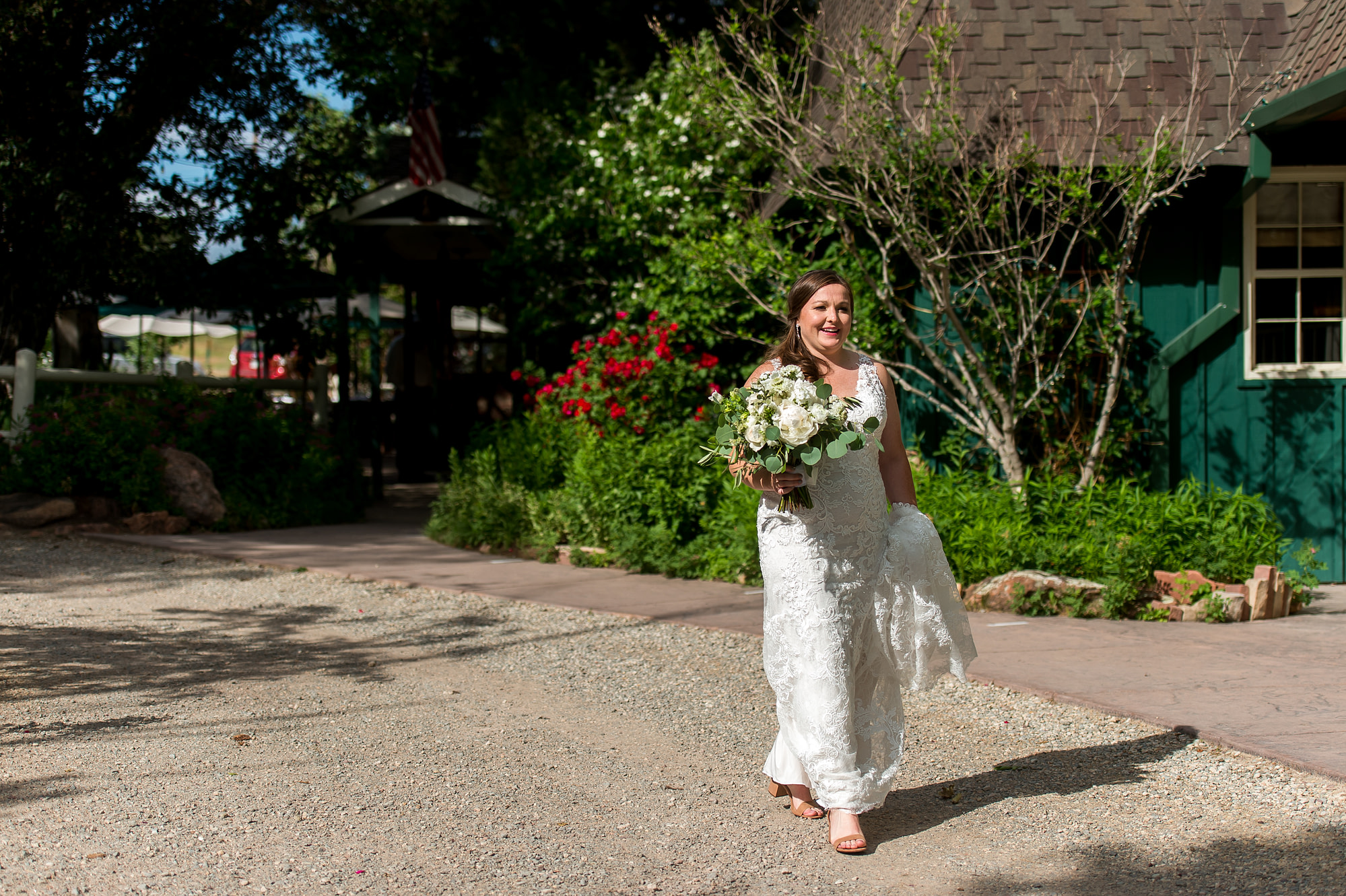 The bride walks to the ceremony at the Greenbriar Inn wedding in Boulder, Colorado.