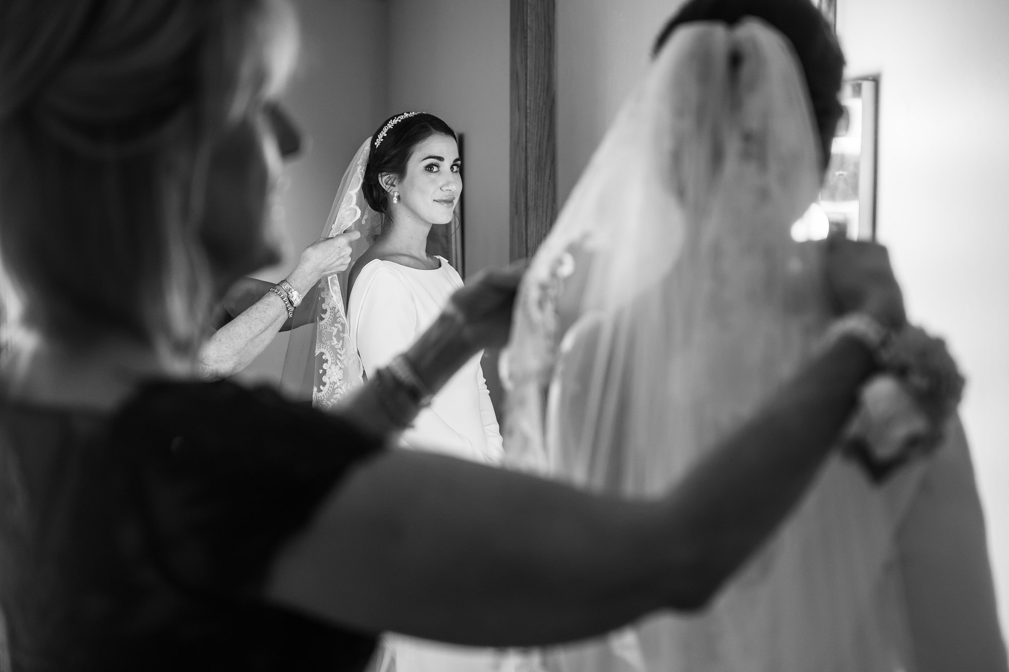 Bride gets ready during her Holy Ghost Church Denver wedding in Denver, Colorado.